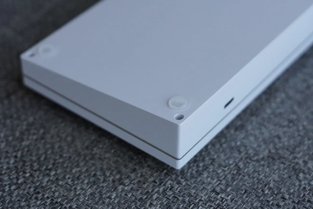 White milled-aluminum bottom case with its USB-C opening.
