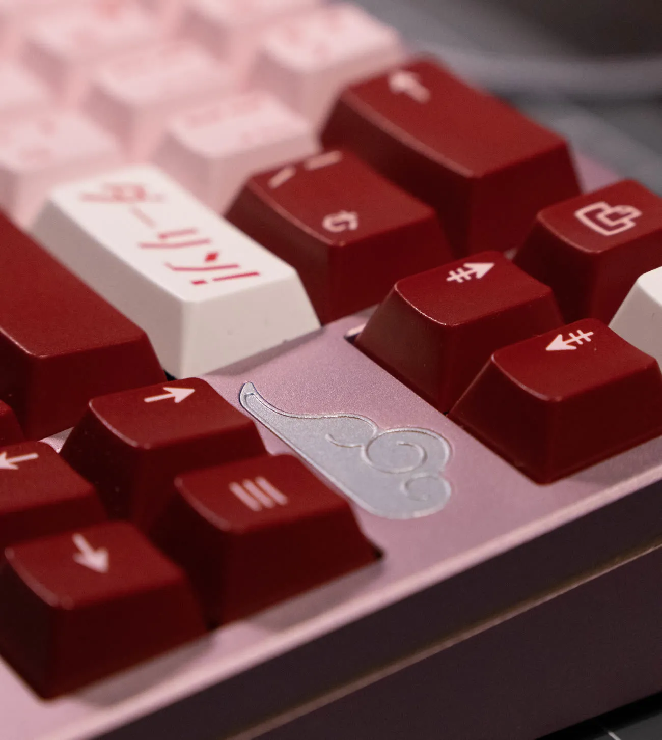 A red and pink community build with Japanese-legend keycaps.