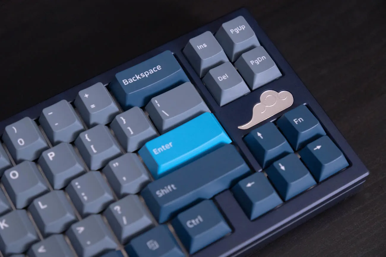 The cloud badge beside the arrow cluster on a blue build.